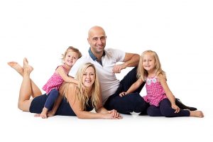 Your Family Portraits sitting on the Floor with two girls, in Watford.